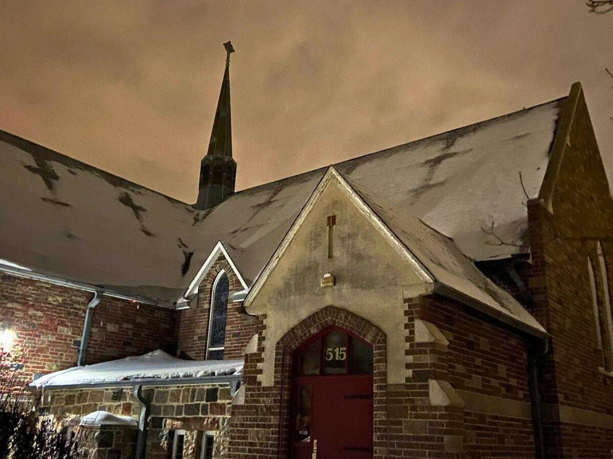 Church at dusk with menacing sky